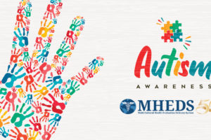A colorful handprint made of small, multicolored handprints is on the left. On the right, text reads Autism Awareness with a puzzle piece logo, and MHEDS 50 Years with a medical caduceus symbol.