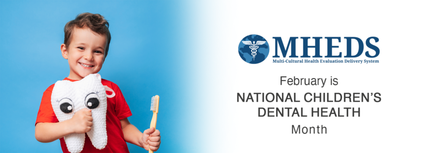 Smiling young boy holds a plush tooth and a large toothbrush, standing next to text that reads “February is National Children’s Dental Health Month” with the MHEDS logo above.