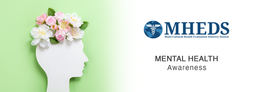 A white silhouette of a human head filled with pink and white flowers on a green background, next to the MHEDS logo and the words MENTAL HEALTH Awareness on a white background.