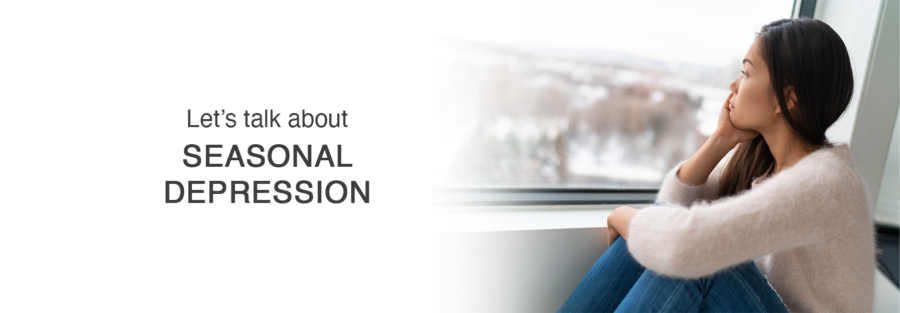 A woman sits by a window, looking outside thoughtfully. The text on the left reads, Lets talk about seasonal depression. Snowy scenery is visible through the window.