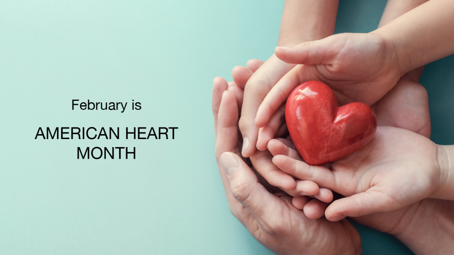Hands of an adult and child holding a red heart together on a blue background. Text on the left reads: February is AMERICAN HEART MONTH.