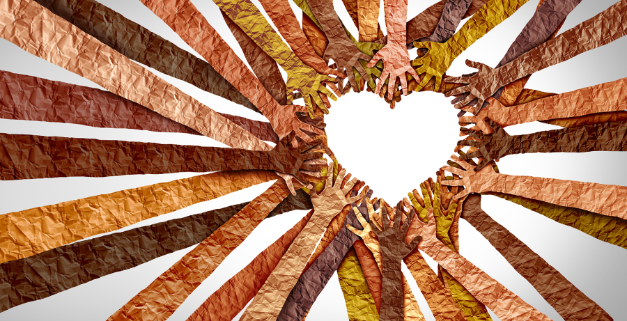 Multiple paper-textured hands of different skin tones reach towards the center, forming a heart shape in the middle, symbolizing unity, diversity, love, and community.