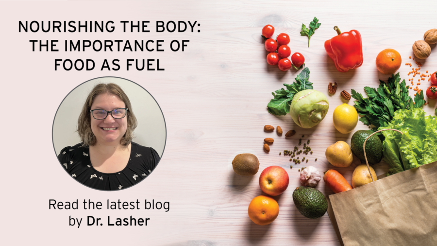 A smiling woman with glasses is pictured next to the text, Nourishing the Body: The Importance of Food as Fuel. Read the latest blog by Dr. Lasher. Fresh fruits and vegetables spill from a paper bag on a light wood surface.